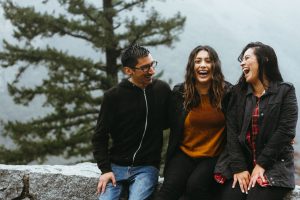 Group of people laughing while outside. A therapist in greenwood village, co is here to help you manage life's challenges. Learn more about sex positive therapy in greenwood village, co